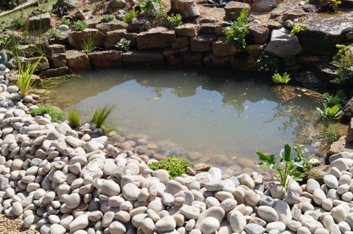 Click Here To Enlarge This Photo Of Creative stream and pond with wine bottles