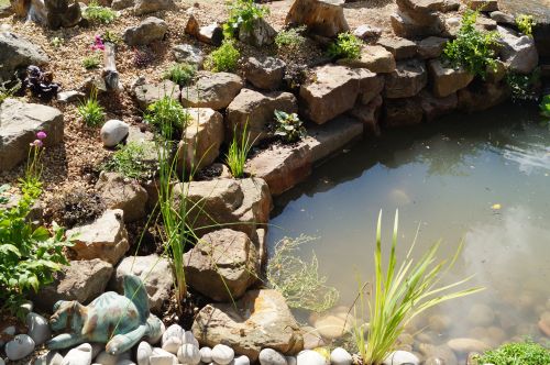 Click Here To Enlarge This Photo Of Creative stream and pond with wine bottles