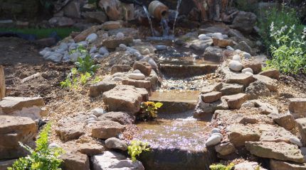 Creative stream and pond with wine bottles